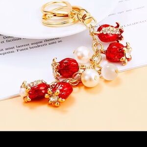 NWT Luxurious Red and Gold Keychain with Pearls